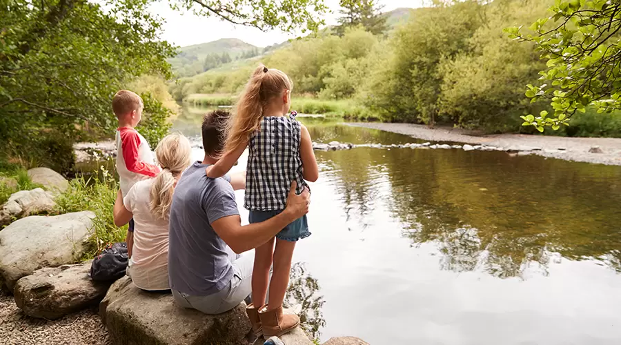 Family looking over a river